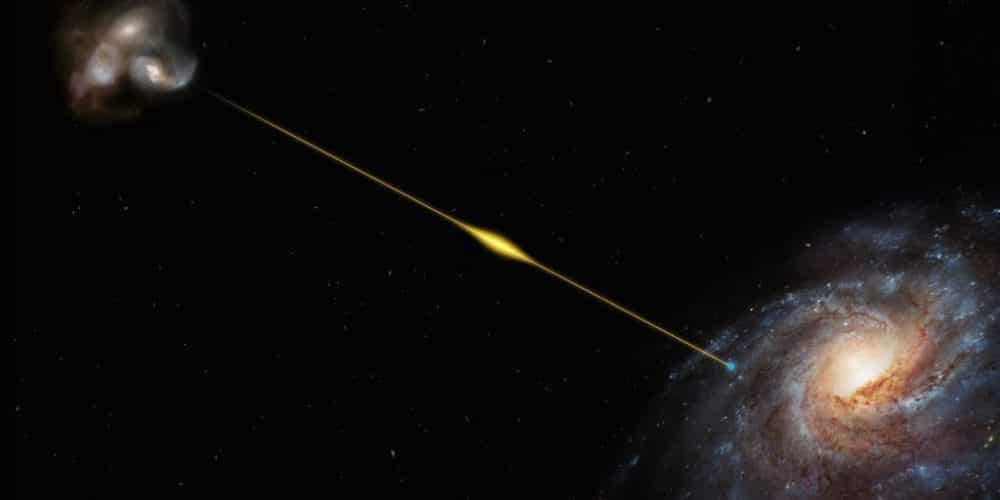 Esta reproducción artística (no a escala) ilustra la trayectoria de la ráfaga rápida de radio FRB 20220610A, desde la galaxia distante donde se originó hasta la Tierra, situada en uno de los brazos espirales de la Vía Láctea. La galaxia fuente de FRB 20220610A, identificada gracias al Very Large Telescope (VLT) de ESO, parece estar ubicada dentro de un pequeño grupo de galaxias en interacción. Está tan lejos que su luz tardó ocho mil millones de años en llegar a nosotros, lo que convierte a FRB 20220610A en la ráfaga rápida de radio más distante encontrada hasta la fecha.