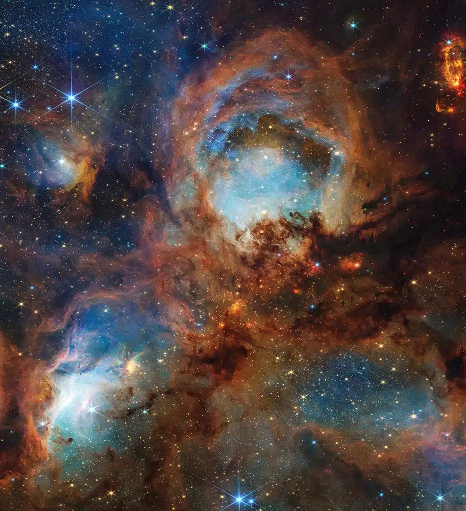 La imagen de la Nebulosa Pata de Gato del Webb revela una escena caótica aún en desarrollo: estrellas jóvenes y masivas están erosionando el gas y el polvo cercanos, mientras su intensa luz estelar produce un resplandor nebuloso brillante representado en azul. Esto es solo un capítulo dentro de la historia más amplia de la región. Las estrellas jóvenes, disruptivas por su corta vida y gran luminosidad, acabarán por extinguir el proceso local de formación estelar.